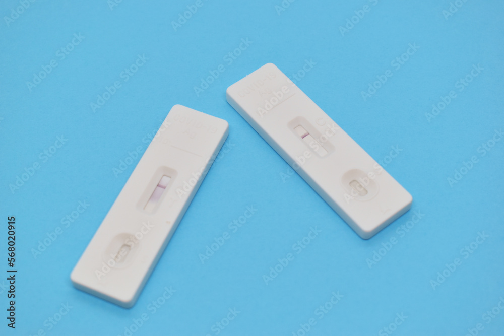 covid test kit on blue background covid test kit on blue background