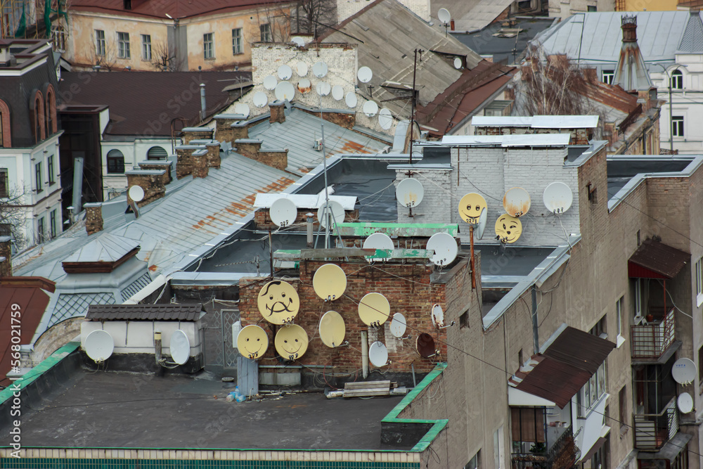Painted satellite TV and internet dishes on the roofs
