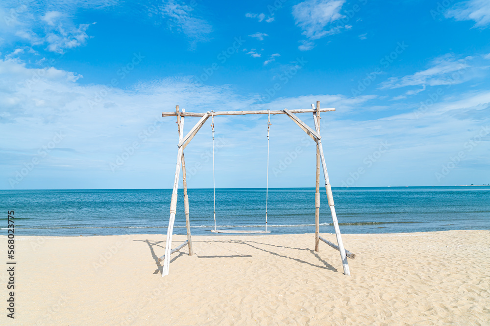 wooden swing on the beach