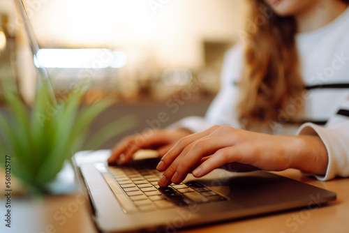 Female hands working on a laptop, close-up. Technology, Freelance, online course, remote work, internet concept.