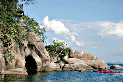 Kayakers exploring the beautiful waters and beautiful rock formations of Lake Malawi near Mumbo Island. photo