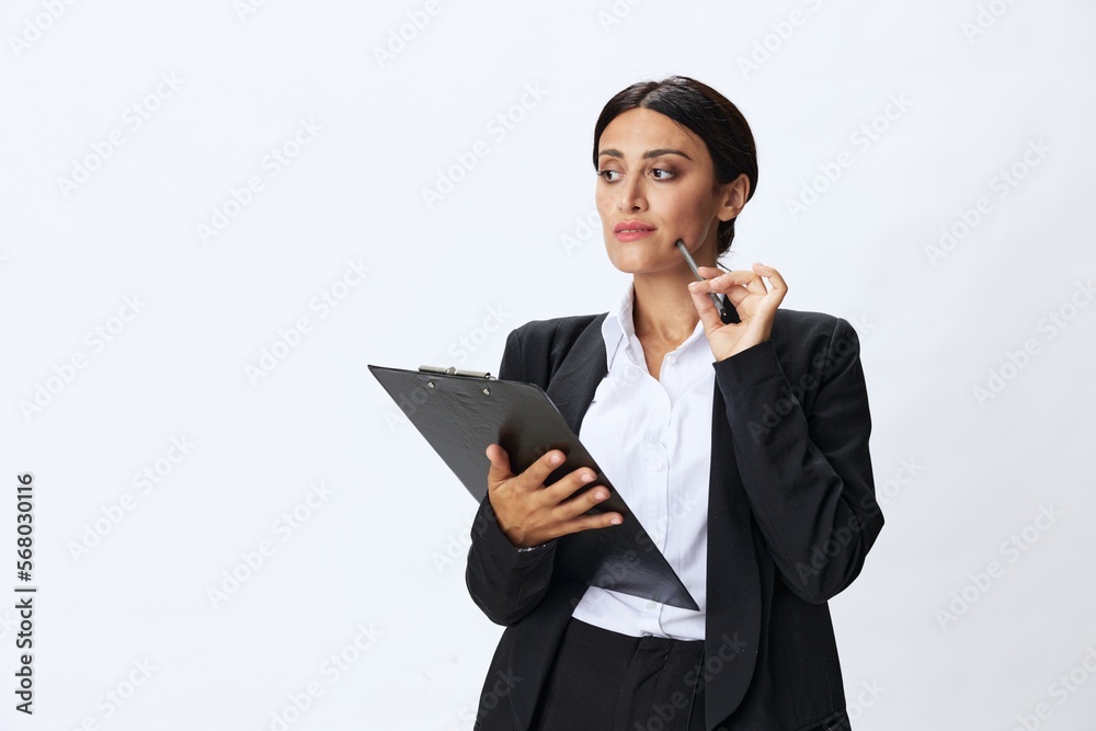 Business woman folder with documents in black business suit shows signals gestures and emotions on white background, freelancer job online time management Business woman folder with documents in black business suit shows signals gestures and emotions on white background, freelancer job online time management