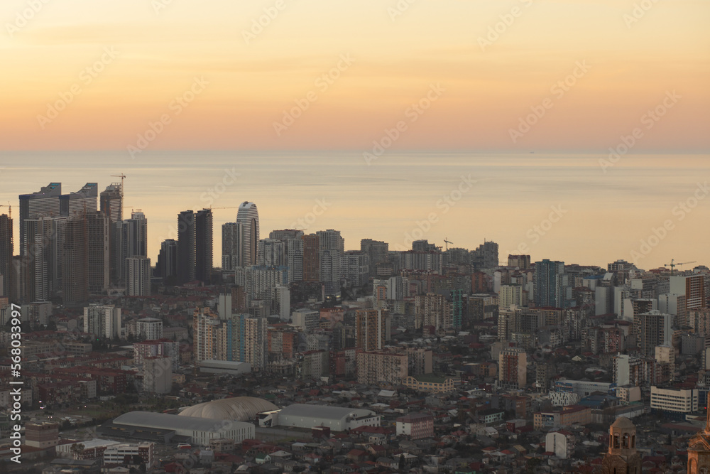 city sunset, evening sunrise, sea view, aerial cityscape with modern architecture