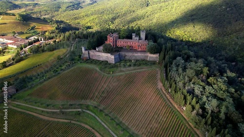 Idyllic nature scenery of Tuscany. Aerial drone view of grapevine fields and castle Brolio, Chianti region, Italy photo