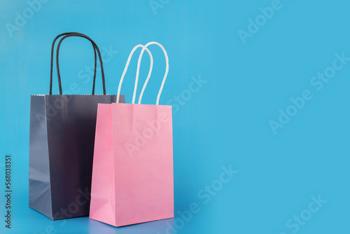 shopping bags on blue background, gift bags, online shopping, sale and discount