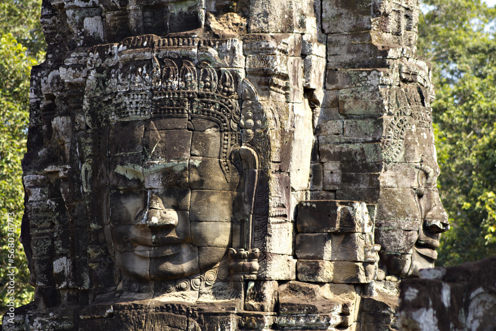 Massive faces carved into the rock of the ancient Bayon Temple in Siem Riep, Cambodia.