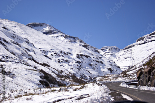 Obraz na płótnie A road winds up a pass through a mountainous landscape in the Kingdom of Lesotho, Africa
