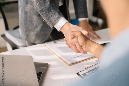 Obraz na plátně Close up two men shake hands at office negotiations