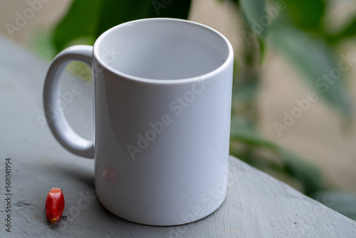 Close-Up of a White Ceramic Coffee Mug with a Blurred Background