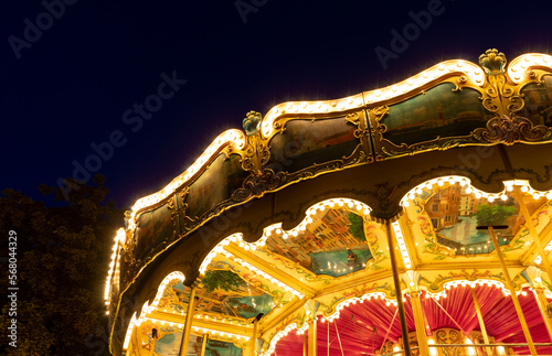 A merry-go-round ride, all lit up at night, in Copenhagen, Denmark