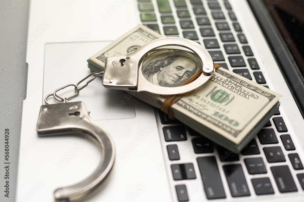 A modern take on the balance between technology and restrictions. A laptop with handcuffs symbolizing the limitations of remote work and online education. Showcasing trend of balancing independence A modern take on the balance between technology and restrictions. A laptop with handcuffs symbolizing the limitations of remote work and online education. Showcasing trend of balancing independence