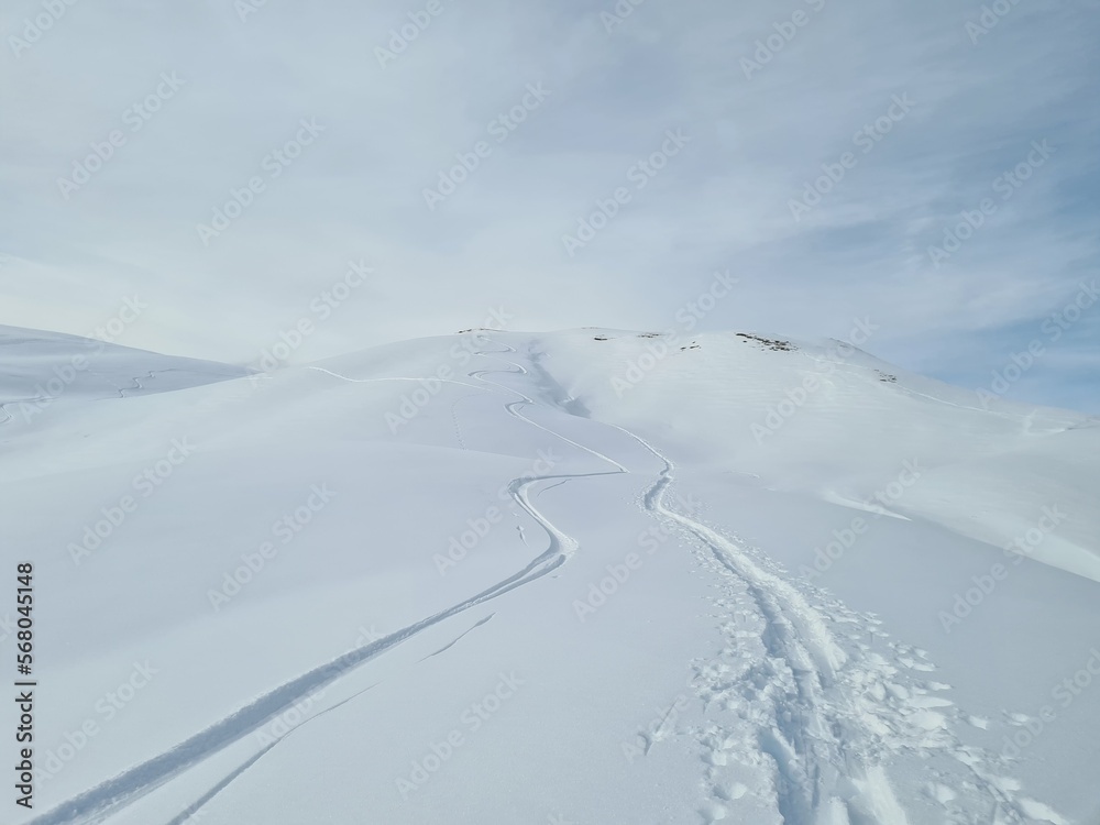 Ski touring in deep snow. Beautiful trail in deep snow. Mountain landscape