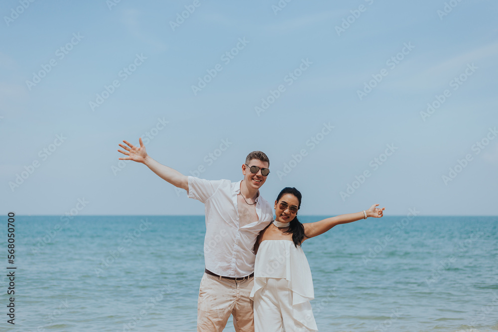 Romantic couple love happy on the beach. Young man and woman smiling and enjoying together on summer vacation. honeymoon lifestyle, Happy aniversary. Romantic couple love happy on the beach. Young man and woman smiling and enjoying together on summer vacation. honeymoon lifestyle, Happy aniversary.