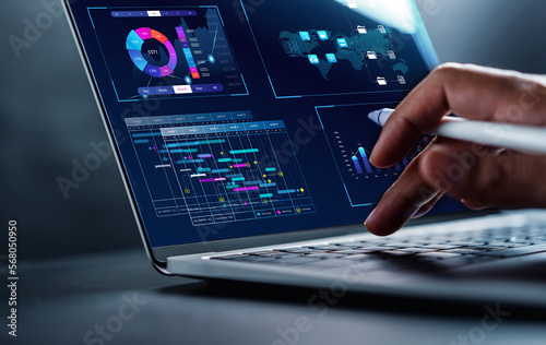 Analyst working in Business Analytics and Data Management System to make report with KPI and metrics connected to database. Corporate strategy for finance, operations, sales, marketing. photo