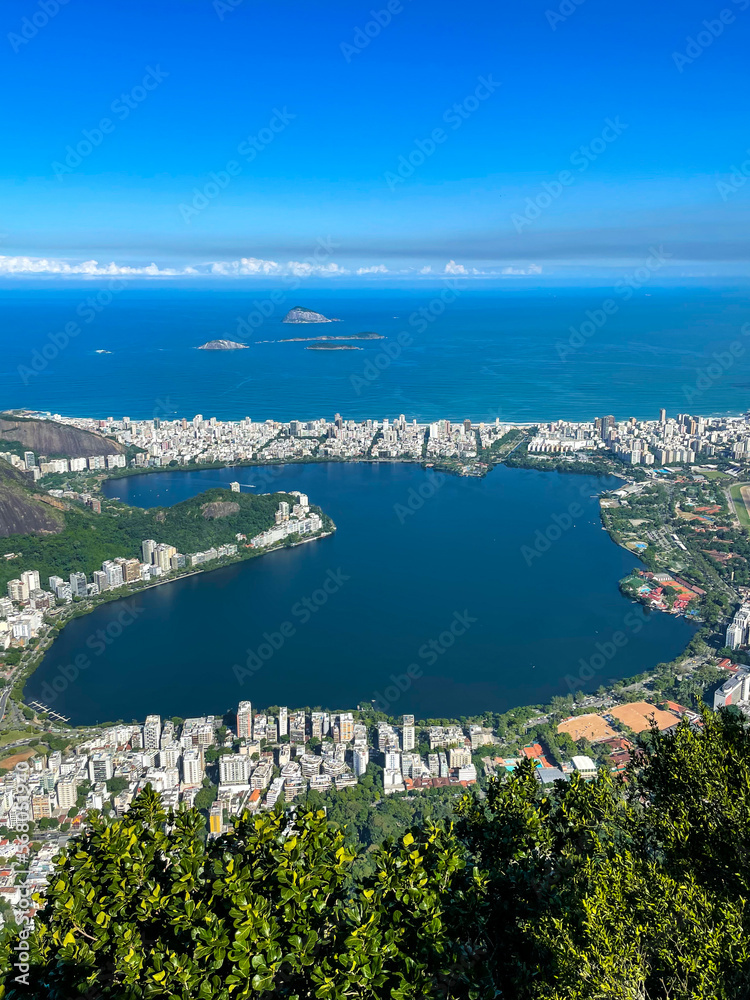 View of Rodrigo de Freitas Lagoon located in Rio de Janeiro (Brazil) surrounded by houses and buildings