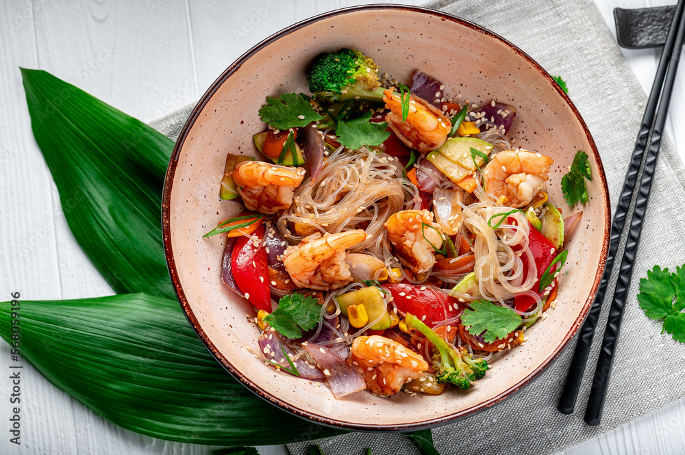 Rice noodles with shrimp and vegetables. Asian cuisine.