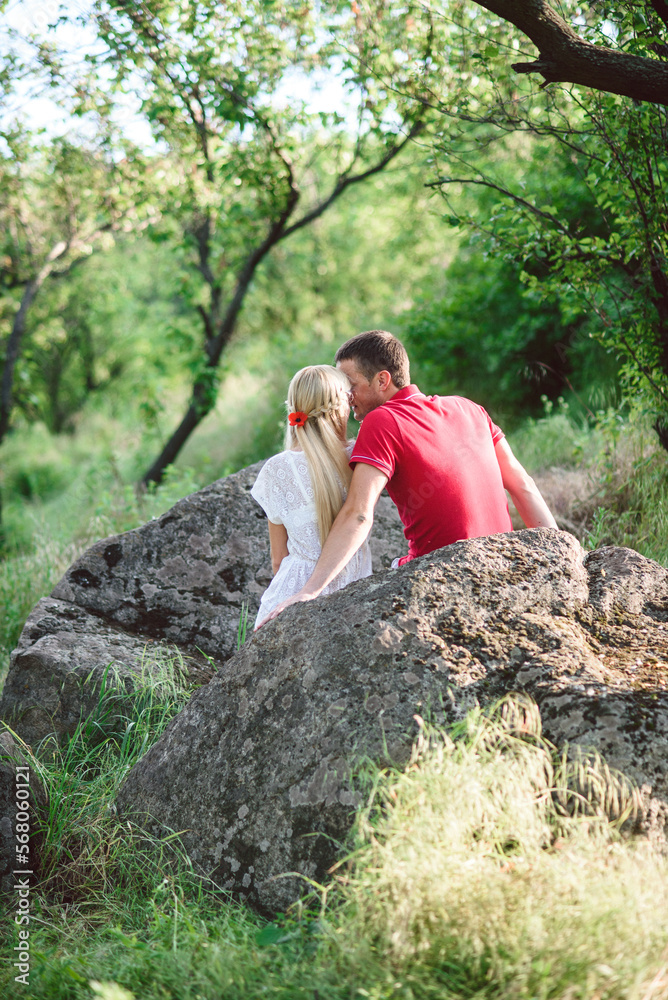 couple in love at a picnic in a park with green grass couple in love at a picnic in a park with green grass