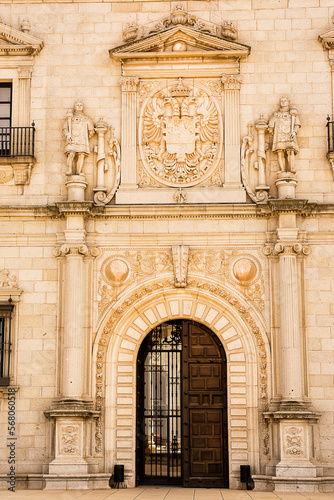 Detail of the gate of the Alcazar of Toledo and the bas-relief work around the gate and the emblem above the gate