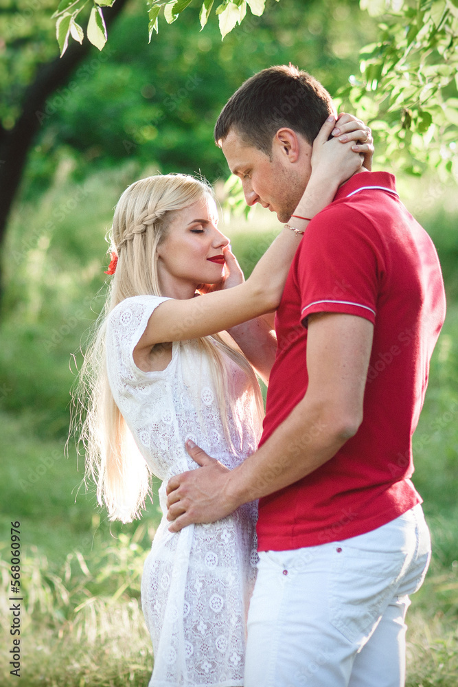 couple in love at a picnic in a park with green grass couple in love at a picnic in a park with green grass