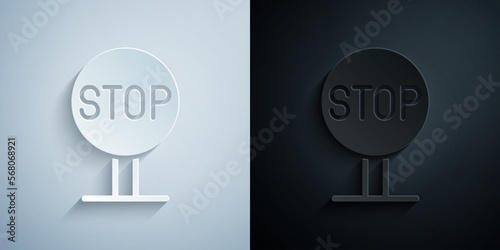 Paper cut Stop sign icon isolated on grey and black background. Traffic regulatory warning stop symbol. Paper art style. Vector