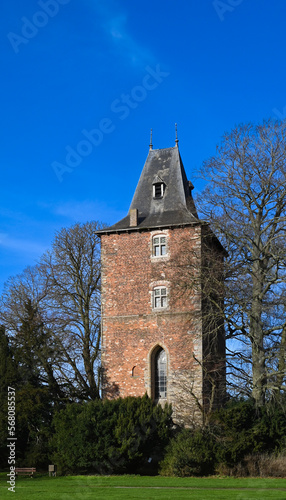 Enghien, Belgium - January 17, 2023 : beautiful view of castle chapel tower, Enghien park