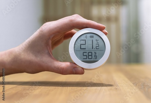 Thermohygrometer, home air quality and humidity control device with normal healthy good numbers of temperature indoor photo