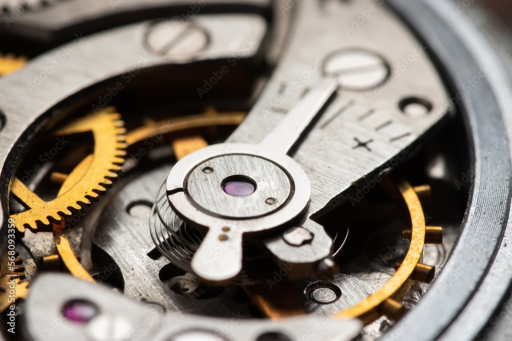 The mechanism of analog hours. A photo close up The mechanism of analog hours. A photo close up