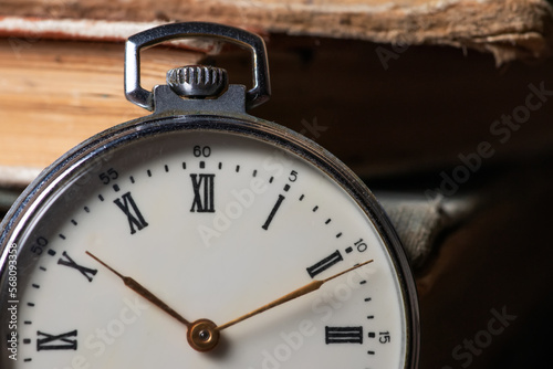 Pocket Watch and Old Book in Vintage Style