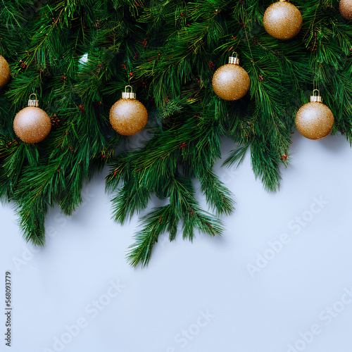 christmas tree branches with christmas balls for background with copyspace, generative ai