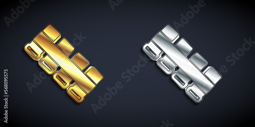 Gold and silver Hunting cartridge belt with cartridges icon isolated on black background. Bandolier sign. Hunter equipment, armament. Long shadow style. Vector