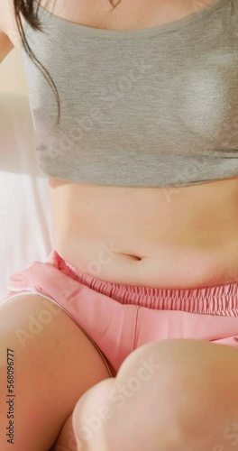 woman pinch excessive fat belly