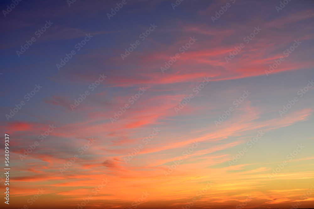 sunset sky with purple, orange, yellow, red and pink clouds isolated