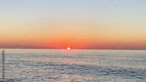 Beautiful sunrise sea and water moviment photo