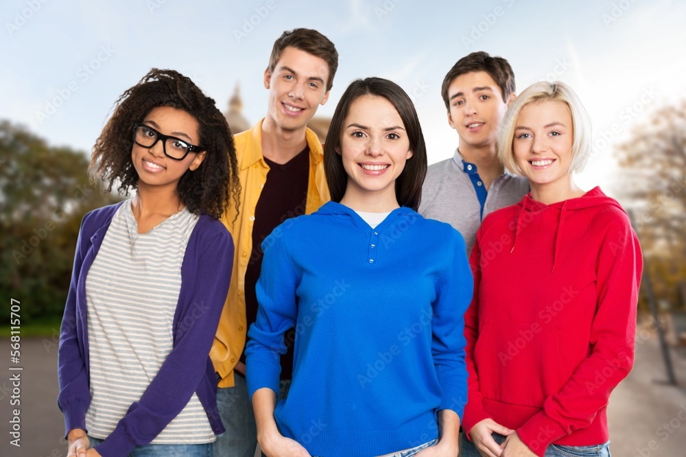 Multiracial happy student friends posing on outdoor Multiracial happy student friends posing on outdoor