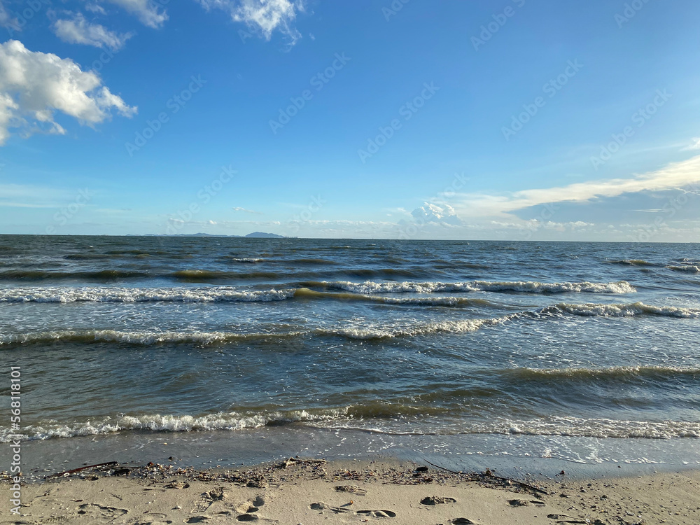 the beauty of the ocean with this stunning beach image featuring sandy shores and crystal clear water. Perfect for travel, summer and nature themes