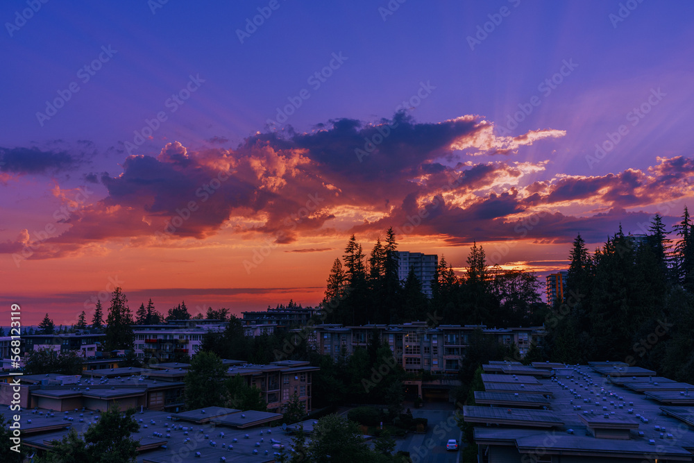 Spectacular sunset over cityscape of residential community of UniverCity on Burnaby Mountain, BC.
