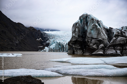 panorama of Svínafellsjökull, mighty glacier in southern iceland; mighty blue glacier surrounded by mountains, glacial lagoon in iceland