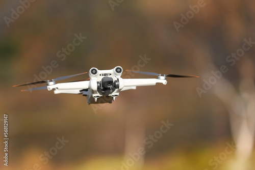 

DJI Mavic mini hovering mid air with bokeh background photo