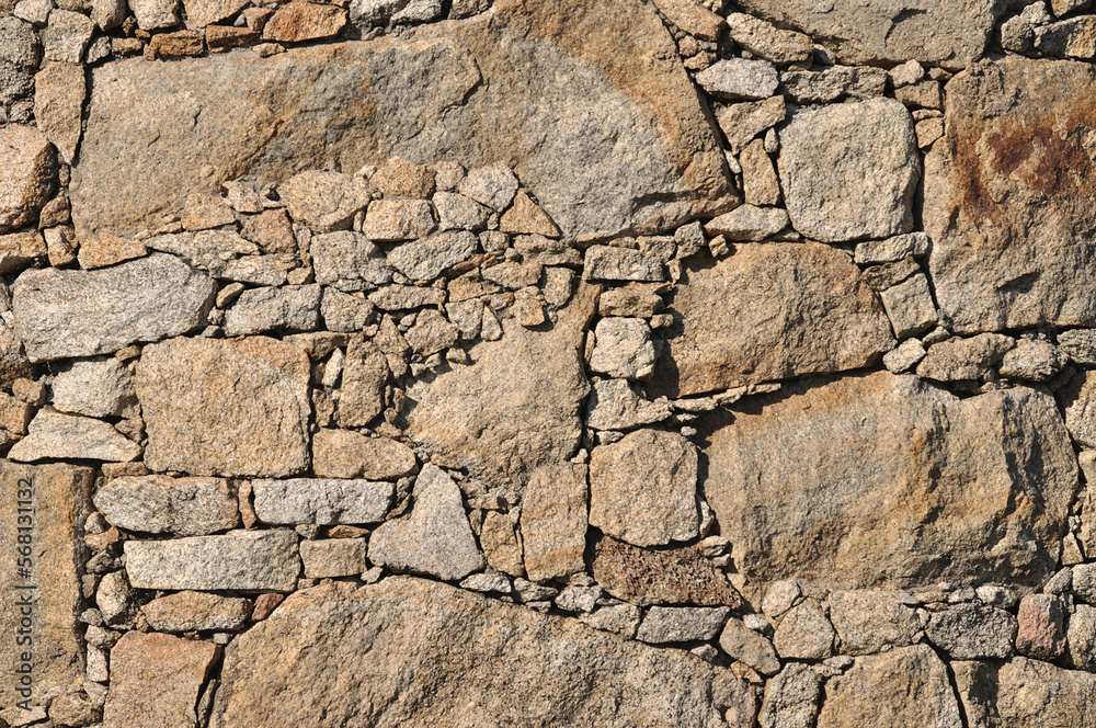 Wall texture built in embedded stones, reliefs Wall texture built in embedded stones, reliefs