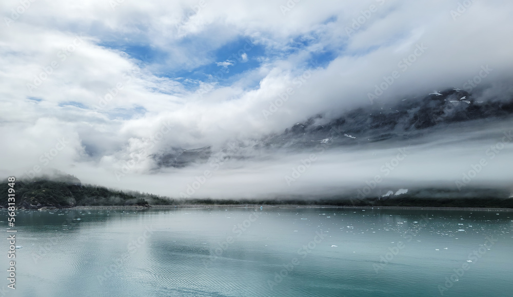 Dramatic clouds and sky along glacier bay in Alaska