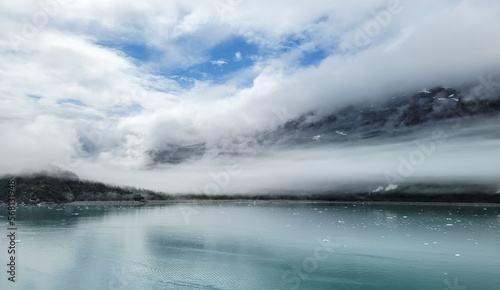 Dramatic clouds and sky along glacier bay in Alaska