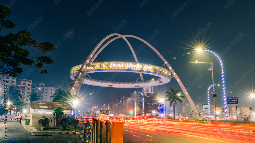 Naklejka premium Biswa Bangla Gate located in Kolkata, West Bengal, India, Night view of a beautiful hanging restaurant