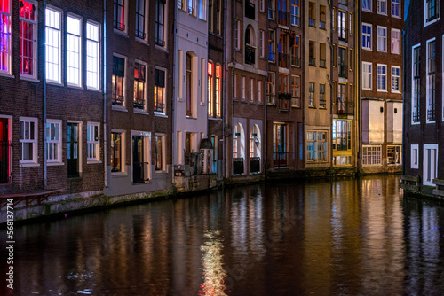 Long exposiure shot of a canal in Amsterdam, the Netherlands. beautiful and colorful lights during the night © Janis Eglins