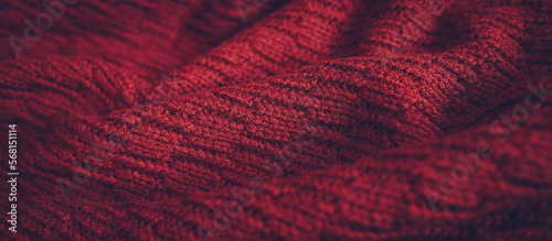 Beautiful knitted texture of red sweater. Close up background