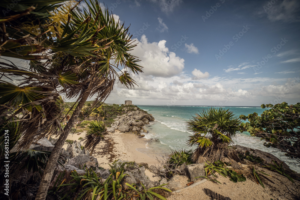 tulum beach with trees and mayan ruins