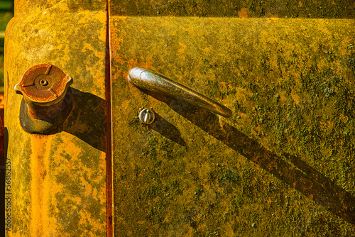Door of a yellow vintage pickup truck (FORD)