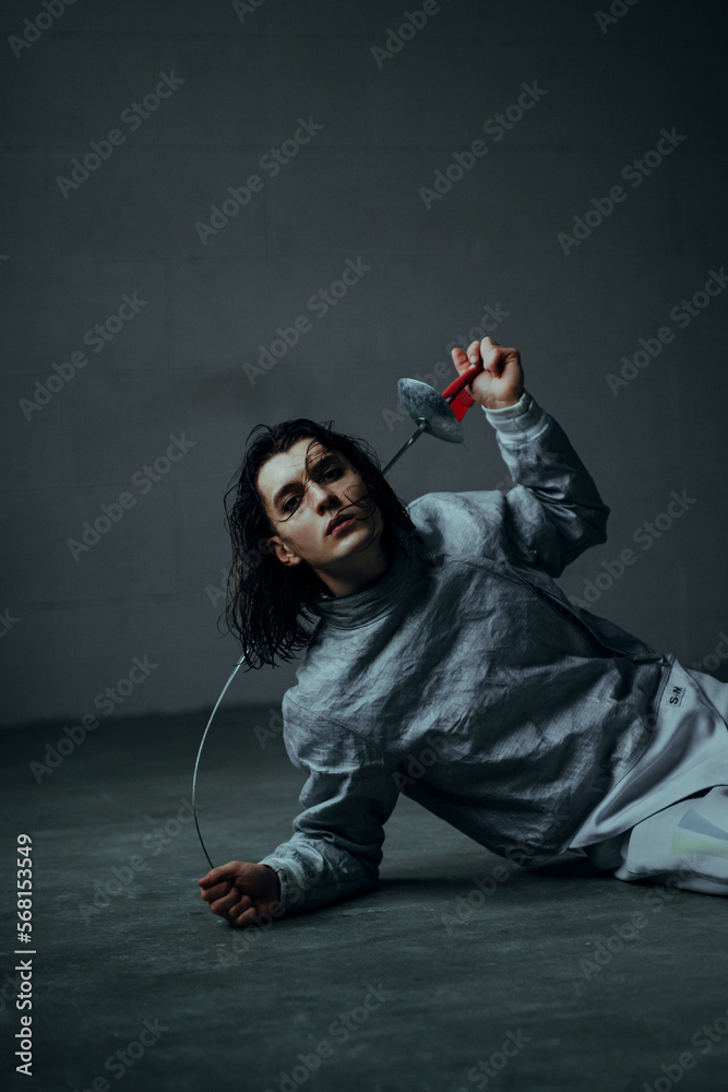 beautiful man fencer with a foil rapier sword beautiful man fencer with a foil rapier sword