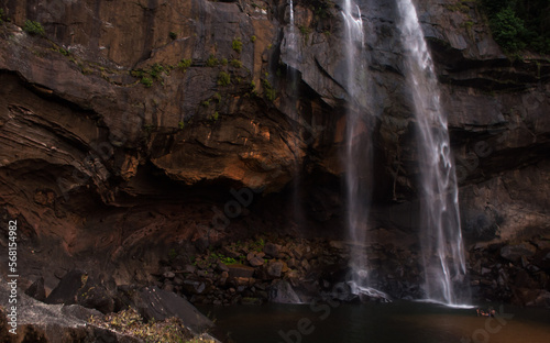 Giant waterfall with interesting rock red texture © Amith