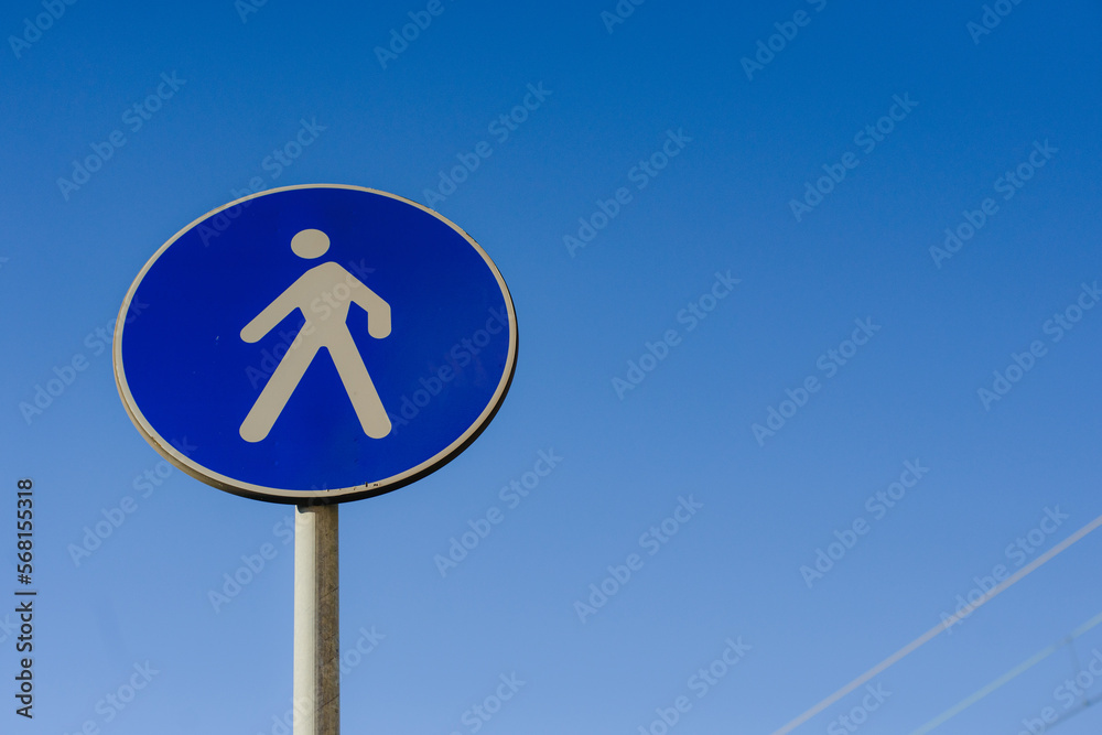 Road car round blue sign. Pedestrian crossing