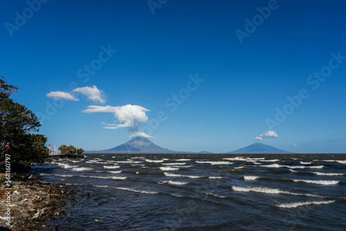 vulcanos at ometepe island with waves on nicaragua lake photo